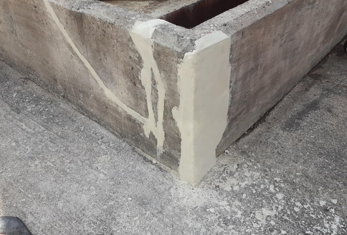 Concrete chemical bund wall rebuilt and lined for secondary containment