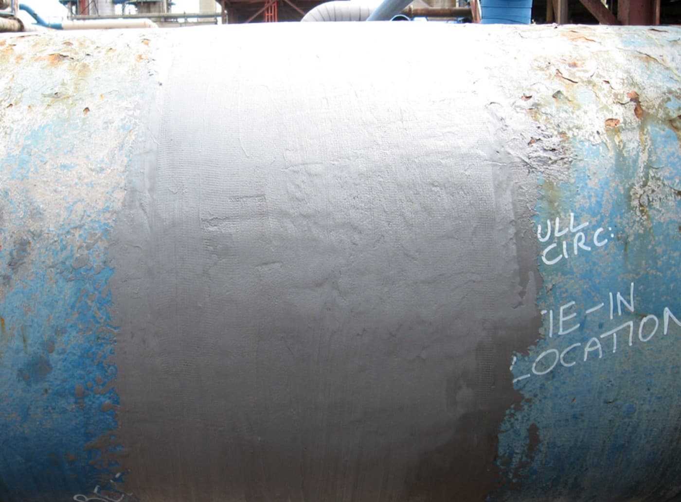 Structural piling rebuilt and wrapped with an engineered composite in the splash zone