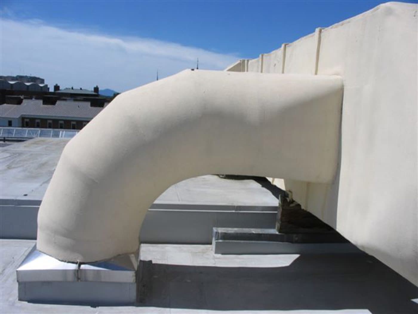 Inlet and outlet duct walls protected against acidic condensate