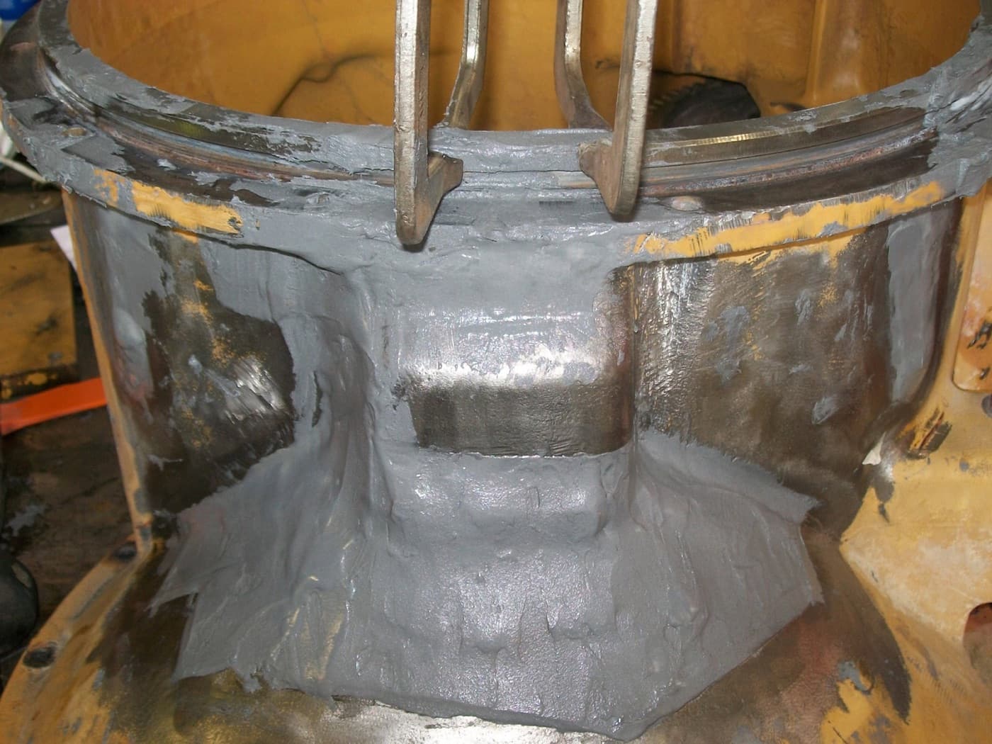 Pitted and thinned vessel steel rebuilt cold with composite