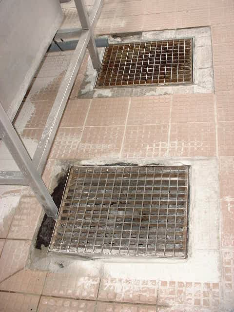 Damaged tiles on kitchen floor