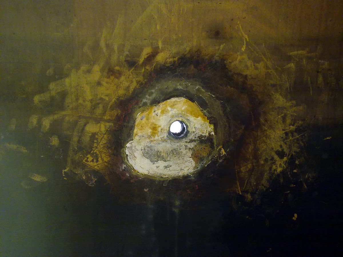 Ebonite lined tank with localised damage due to its acid attack