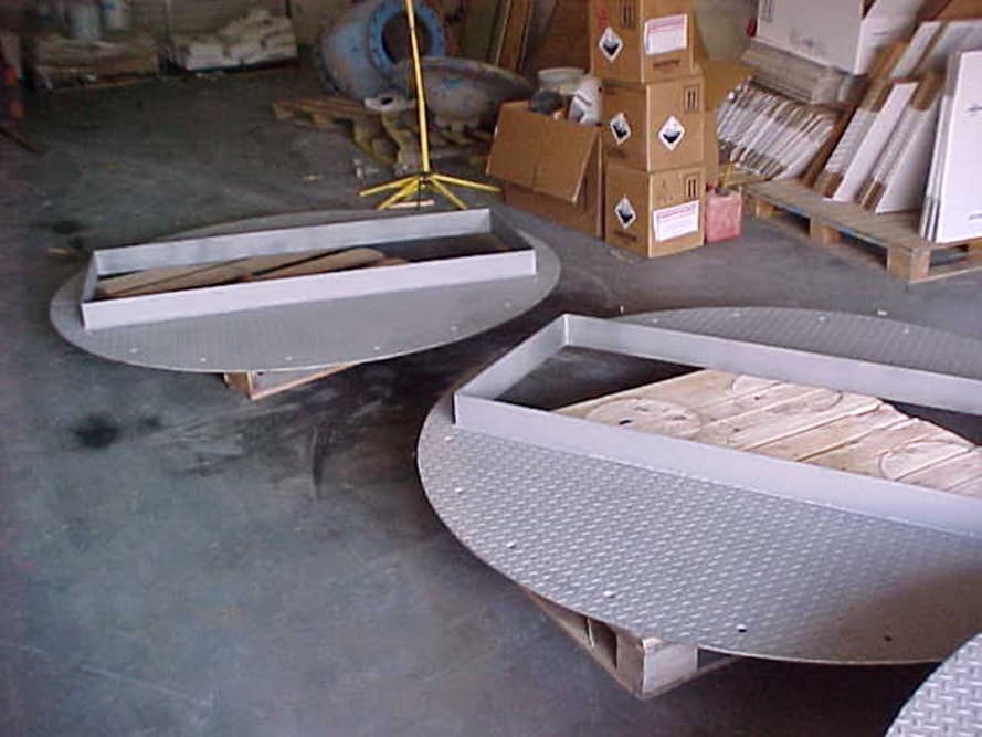 Newly fabricated steel chequer plates requiring acid protection